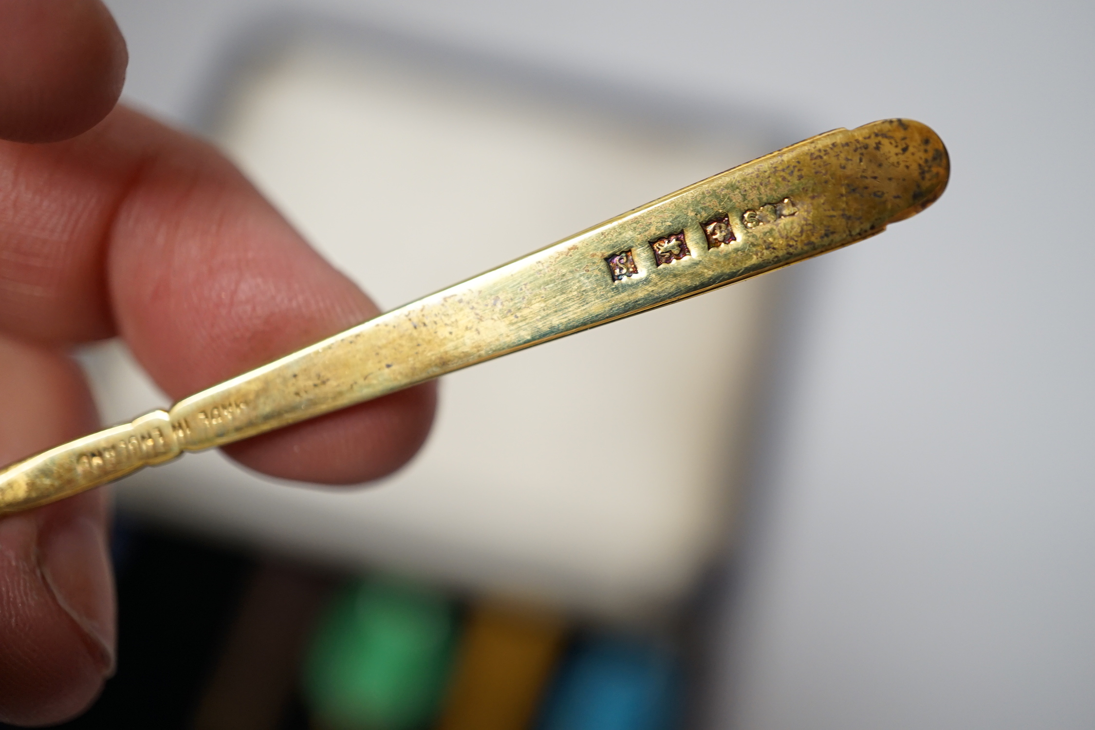 A cased set of six Elizabeth II silver gilt and polychrome enamelled coffee spoons, Turner & Simpson, Birmingham, 1968, 93mm.
